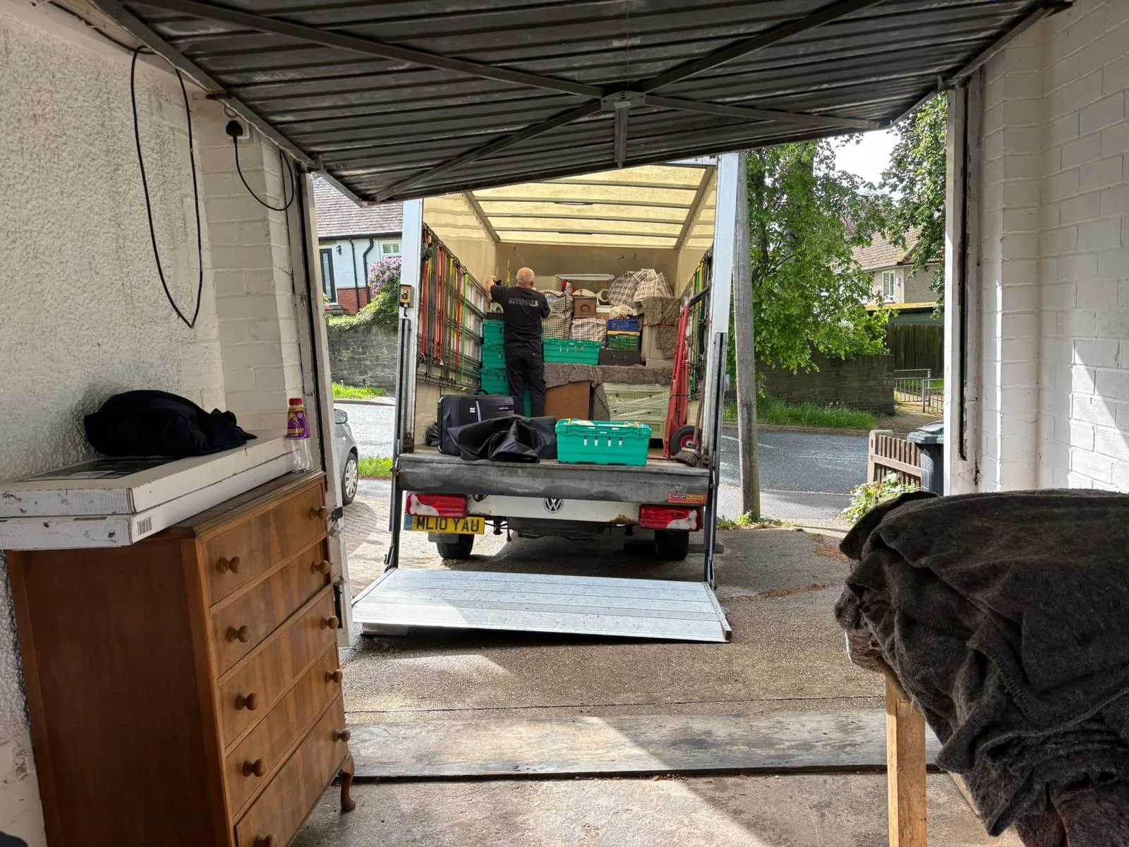 On The Move Removals loading a Luton van from a garage in Birkby, Huddersfield for a small move
