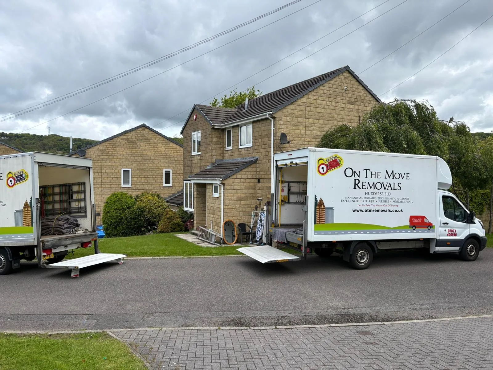 On The Move Removals Luton van parked outside a stone house in Birkby, Huddersfield