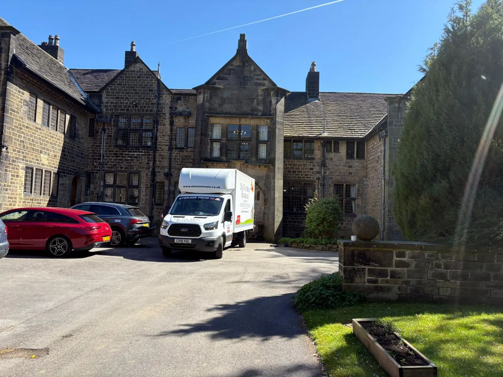 On The Move Removals van parked outside a stone manor home during a Halifax removal