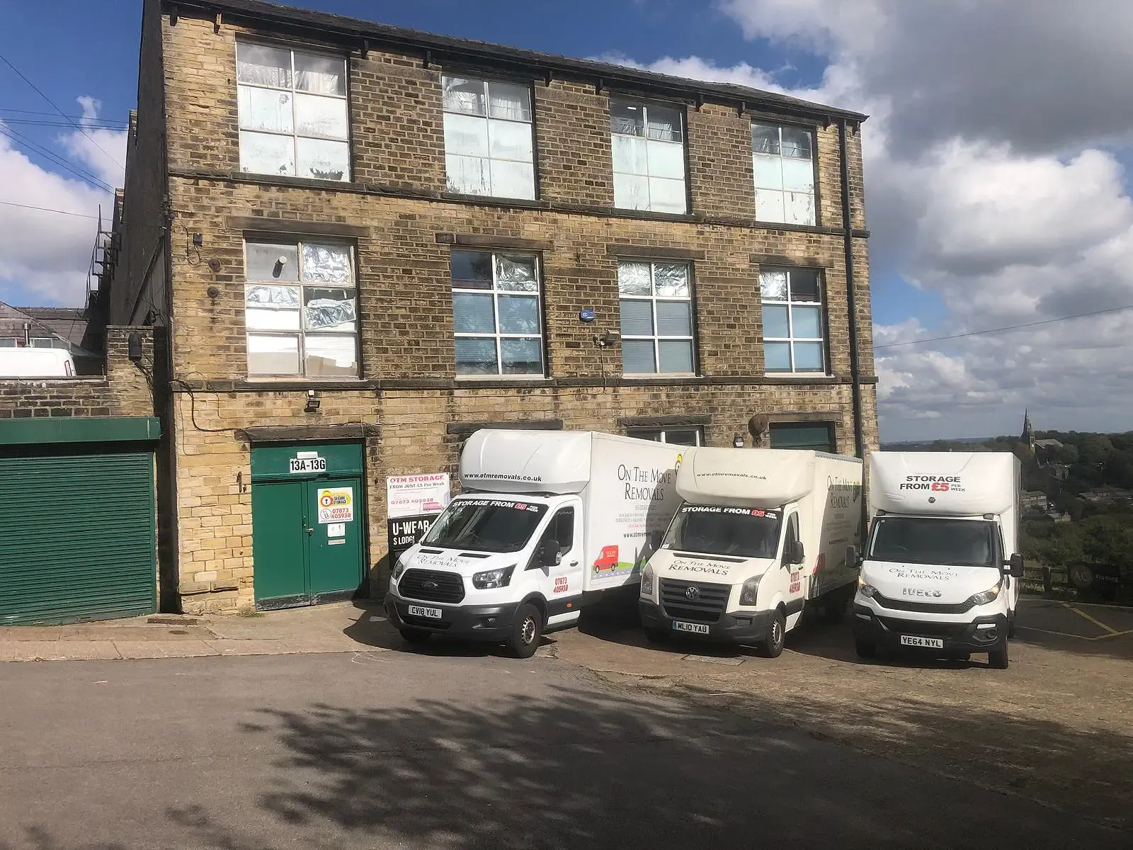 On The Move Removals fleet parked at the self-storage facility in Huddersfield