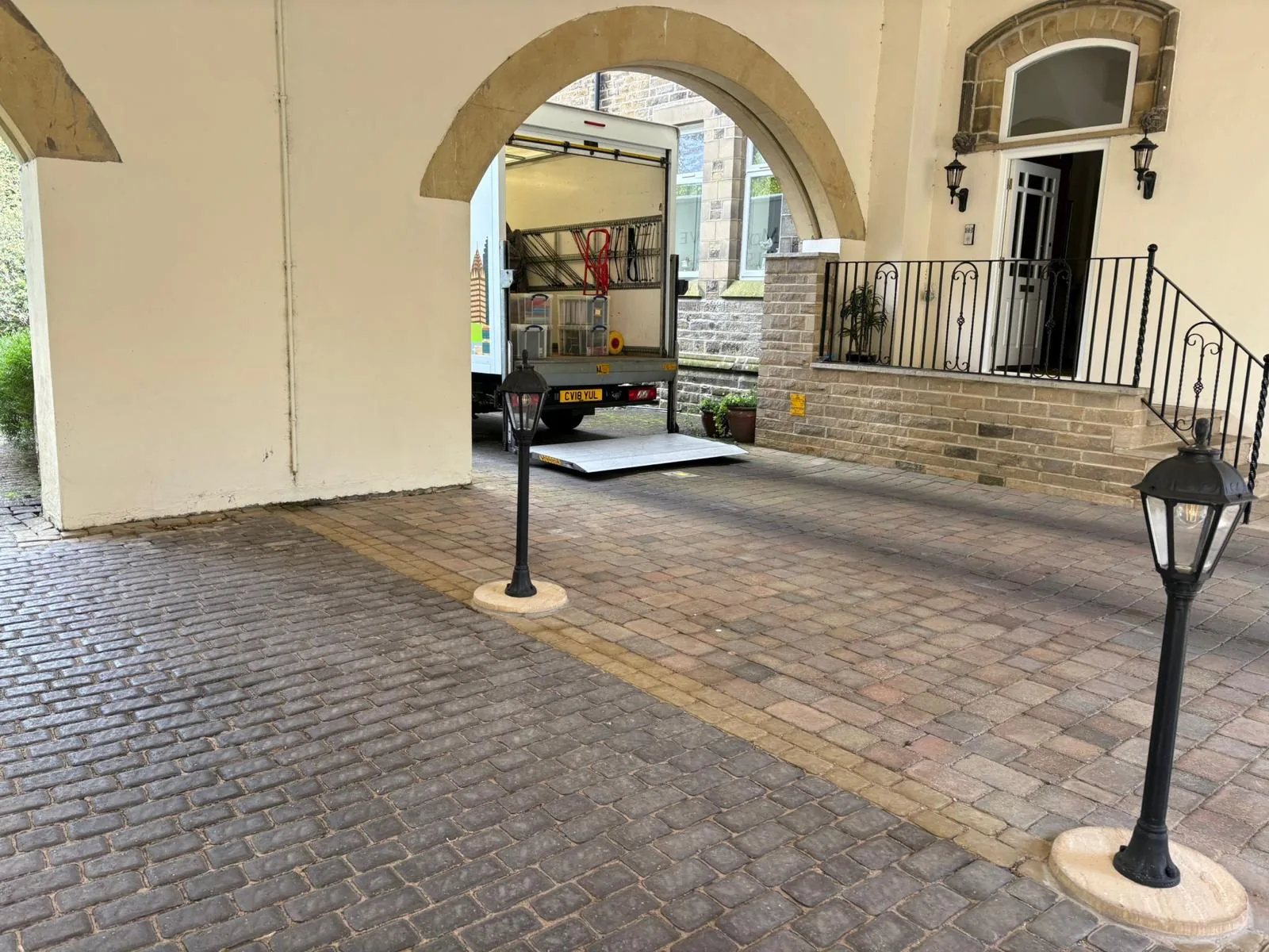 On The Move Removals van parked in a courtyard outside a stone building in Meltham, Huddersfield
