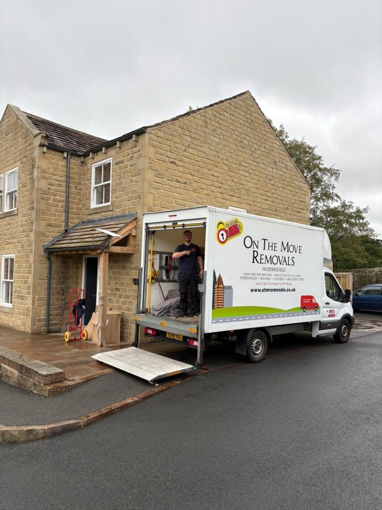 picture of On the Move Removals guy on the back of the van