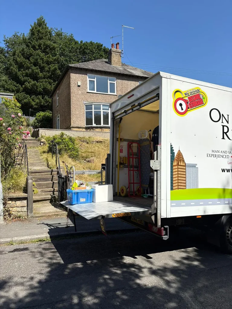 picture of on the move removals van with boxes on the tailgate