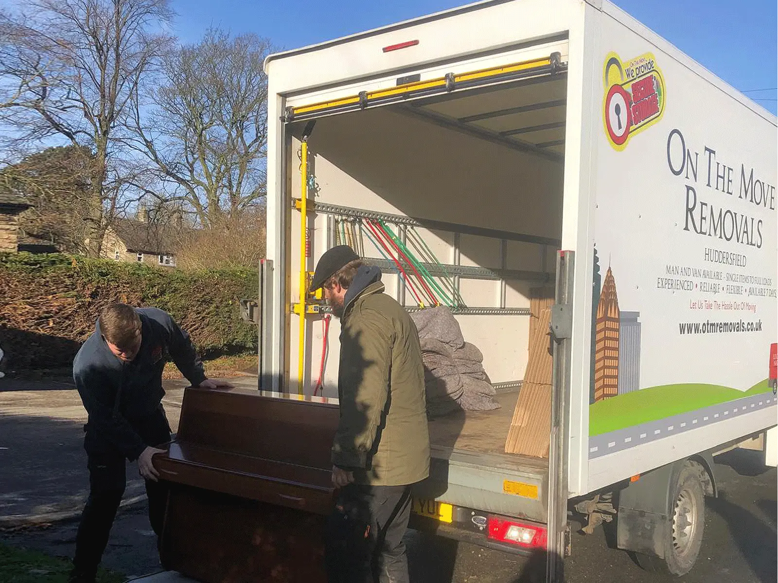 picture of on the move removals moving a piano